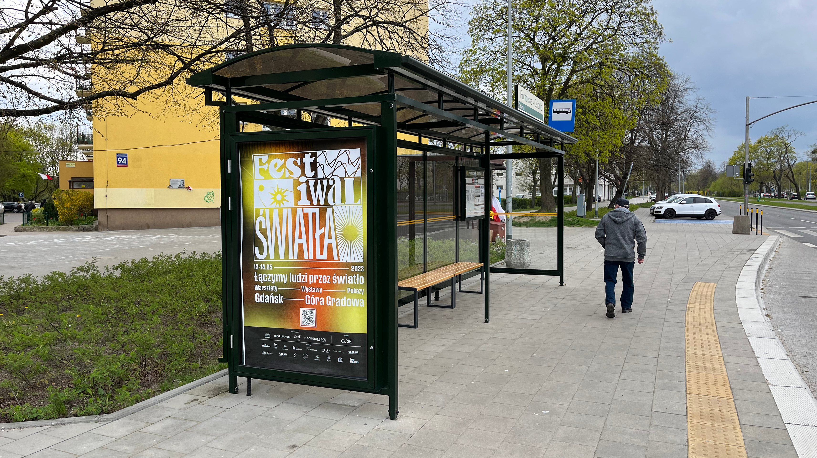 A poster advertising Lights Festival on a buss stop.